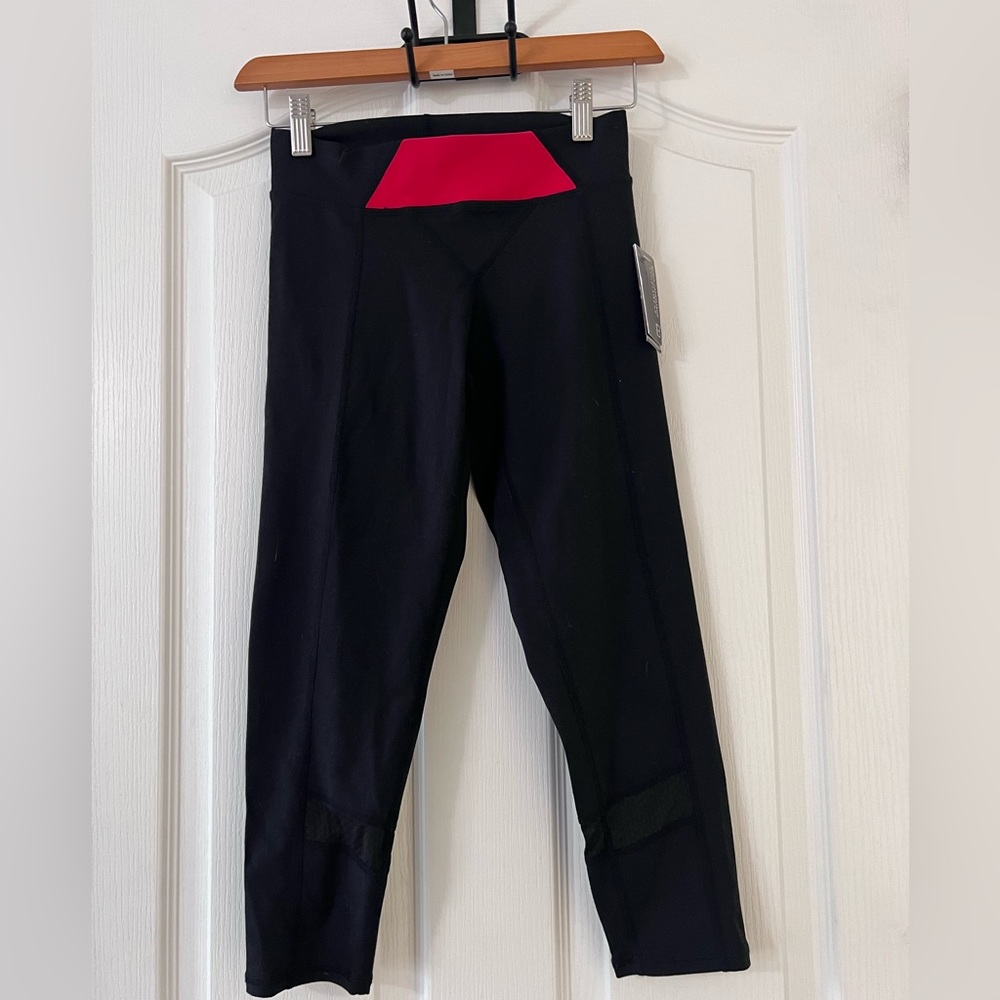 NWT Body language sportswear  leggings. Mesh detail at bottom Small